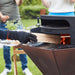 Barbecook Dynamic Pizza oven filling firewood