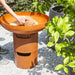 Barbecook Jack Firepit with bases building fire