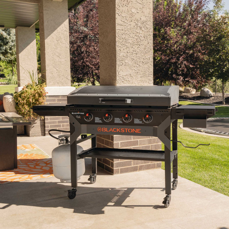 Blackstone 2310 36in Iron Forged Griddle with Hood Outside on patio