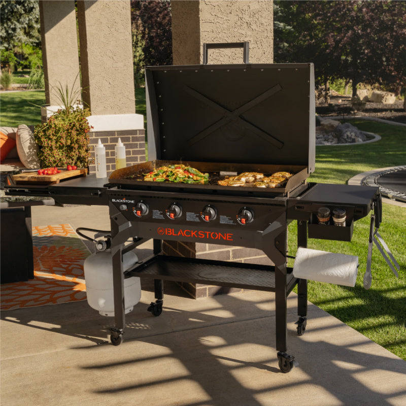Blackstone 2310 36in Iron Forged Griddle with Hood Cooking outside
