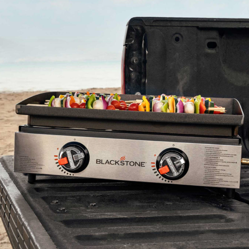 Blackstone 2140 22in Tabletop Griddle cooking kebabas at the beach
