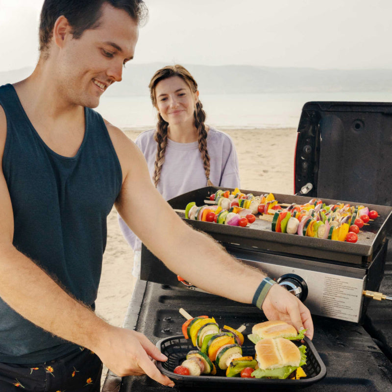 Blackstone 2140 22in Tabletop Griddle cooking at the beach