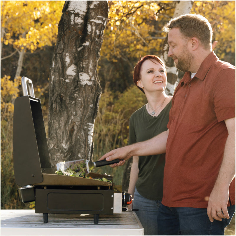 Blackstone 2143 17inch Tabletop Griddle with Hood Open 2 people cooking