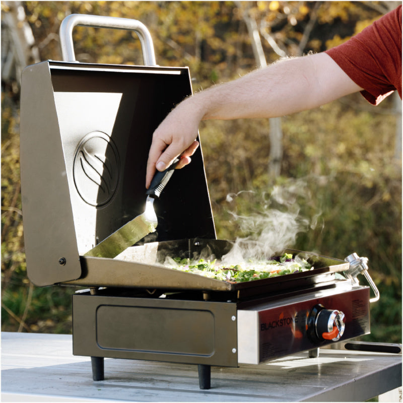 Blackstone 2143 17inch Tabletop Griddle with Hood Open cooking vceges outside
