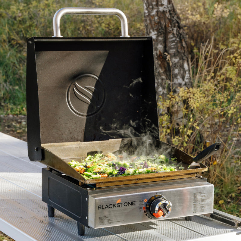 Blackstone 2143 17inch Tabletop Griddle with Hood OPen cooking veges