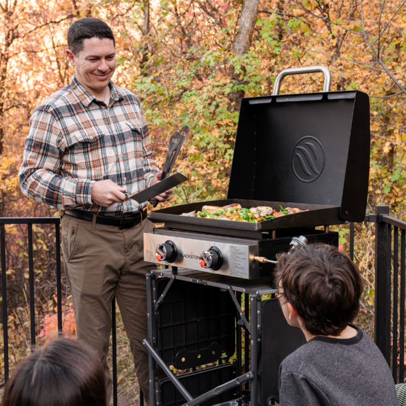 Blackstone 2144EU 22inch Griddle with Hood Man cooking on the Griddle