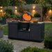 Maze_Ember_Small_Linear_Outdoor_Kitchen_Kamado_Set_outside_with_open_grill_at_night