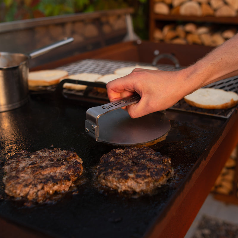 GrillSymbol Charcoal Grill Naked Chef XXL grilling meat patties using burger press
