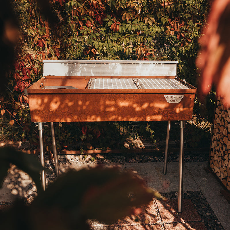 GrillSymbol Charcoal Grill Naked Chef XXL outside on tiles