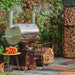 Smoky-BeastSilver_outside_with_wood_stack