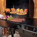 Traeger Woodridge hood open grilling right angle with prep area close up
