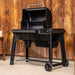 Traeger Woodridge open hood with grate holders on patio