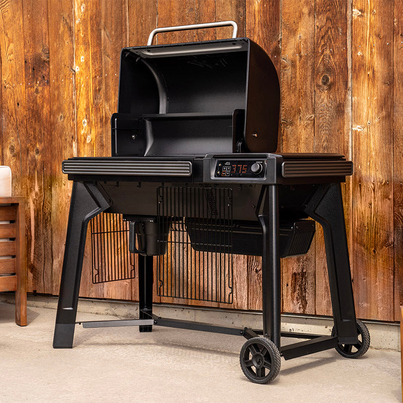 Traeger Woodridge open hood with grate holders on patio