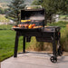 Traeger Woodridge outside grilling food on patio